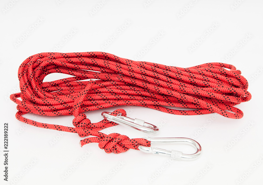 a red climbing rope with snap hooks Stock Photo