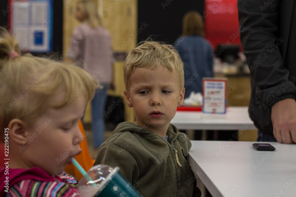 small children eat at a cafe small children eat at a cafe