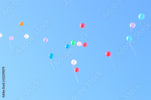 Many colorful ballons in the blue and clear sky. Concept of celebration © ActionGP