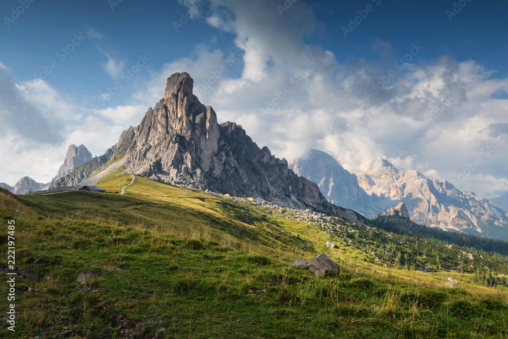 Panoramic evening view of peak Ra Gusela, Averau - Nuvolau group from Passo di Giau. Dramatic summer scene of Dolomiti Alps, Cortina d'Ampezzo location, South Tyrol, Italy, Europe. Panoramic evening view of peak Ra Gusela, Averau - Nuvolau group from Passo di Giau. Dramatic summer scene of Dolomiti Alps, Cortina d'Ampezzo location, South Tyrol, Italy, Europe.