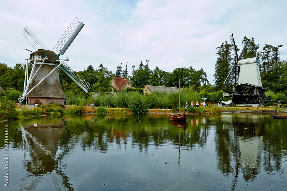 Wind mills close to a lake at Arnhem.  Netherlands July 2018