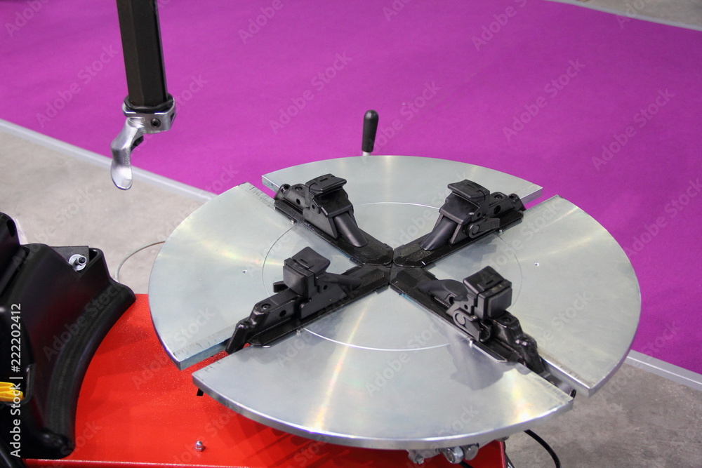 Equipment for car service - close up mounting table of new tire machine for repair (Assembly and disassembly) automobile wheels