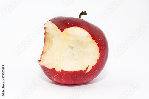 Bitten red apple on a white background.
