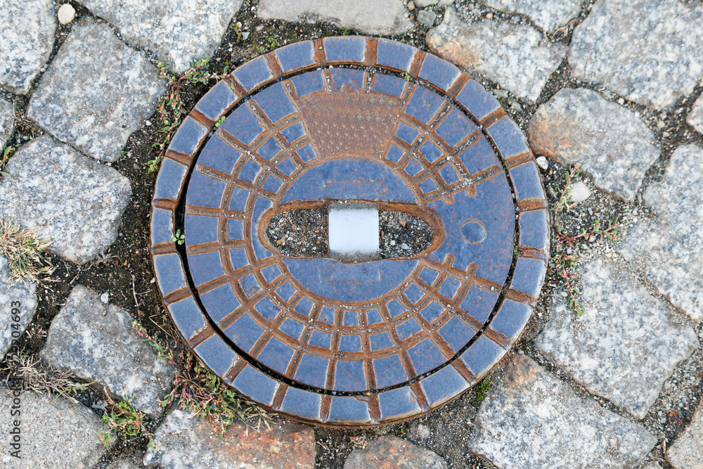 Gully or manhole made of cast iron for water on the street