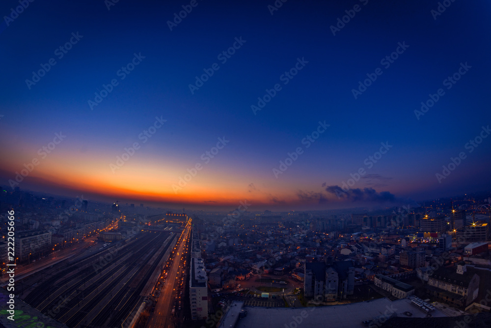 Morning view above the city with city lights and traffic lights and illuminated buildings from Bararab overpass