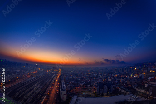 Morning view above the city with city lights and traffic lights and illuminated buildings from Bararab overpass