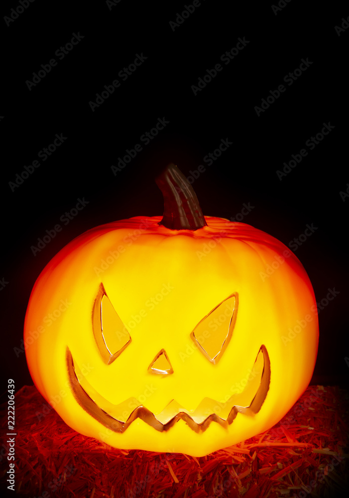 Halloween Background with a Lit Jack-o-Lantern Halloween Background with a Lit Jack-o-Lantern