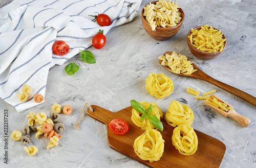 Different mix pasta types on the table, easy food concept, dinner time, homemade