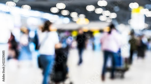 Time-lapse blur of passengers are walking in terminal of airport building located at Bangkok Thailand