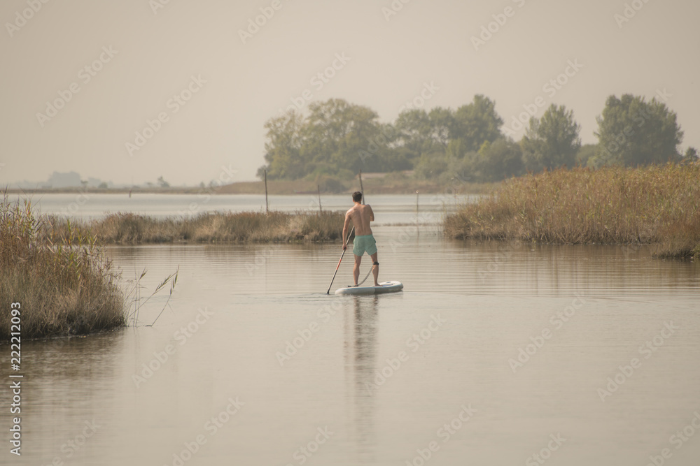Man stand up paddleboarding
