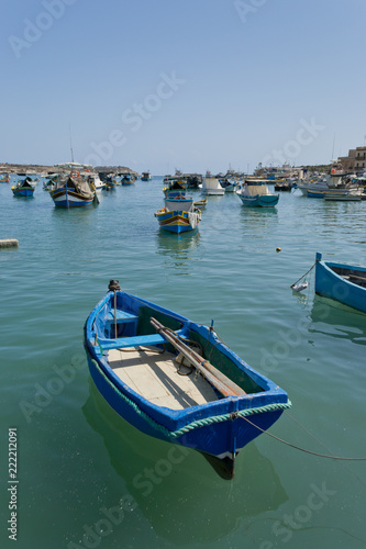 Traditional colorful boats in the Harbor of Mediterranean fishing village Marsaxlokk  Malta