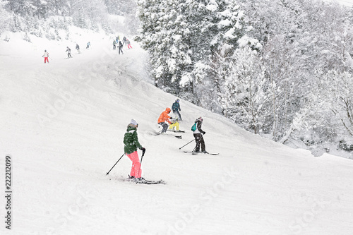Downhill skiing during a heavy snowfall.