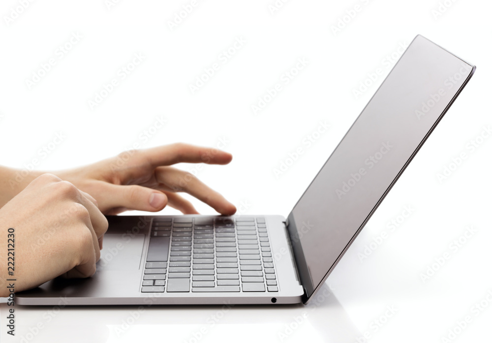 hands typing on laptop keyboard isolated on white background hands typing on laptop keyboard isolated on white background