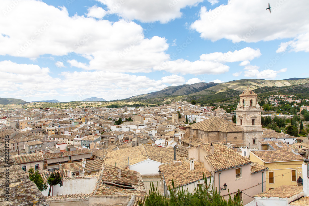 Typical Spanish provincial town from above: tiled roofs, narrow streets, Church. Typical Spanish provincial town from above: tiled roofs, narrow streets, Church.