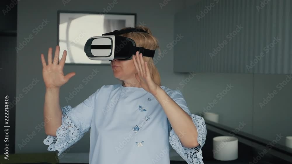 Blonde girl with virtual reality glasses. Modern technologies. The concept of virtual reality Blonde girl with virtual reality glasses. Modern technologies. The concept of virtual reality