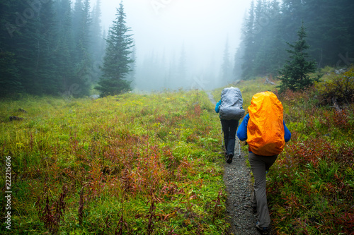 Two people hiking along a trail