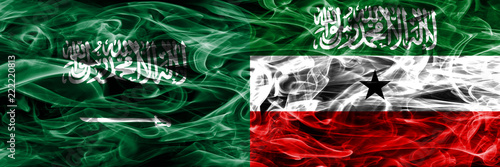 Saudi Arabia vs Somaliland smoke flags placed side by side. Thick colored silky smoke flags of Saudi Arabia and Somaliland.