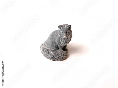 toy figurine of a marbled fox on a white background