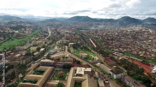 Aerial view of Yaound√©, capital of Cameroon in west Africa. Drone moves forward over the city, toward the horizon. photo