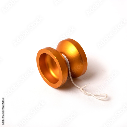 orange metal yo-yo on a white background