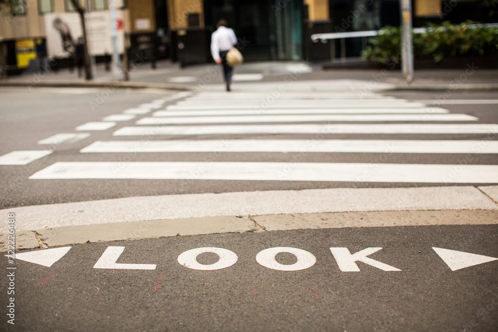 Look before you cross Sidewalk writing sign Look before you cross Sidewalk writing sign