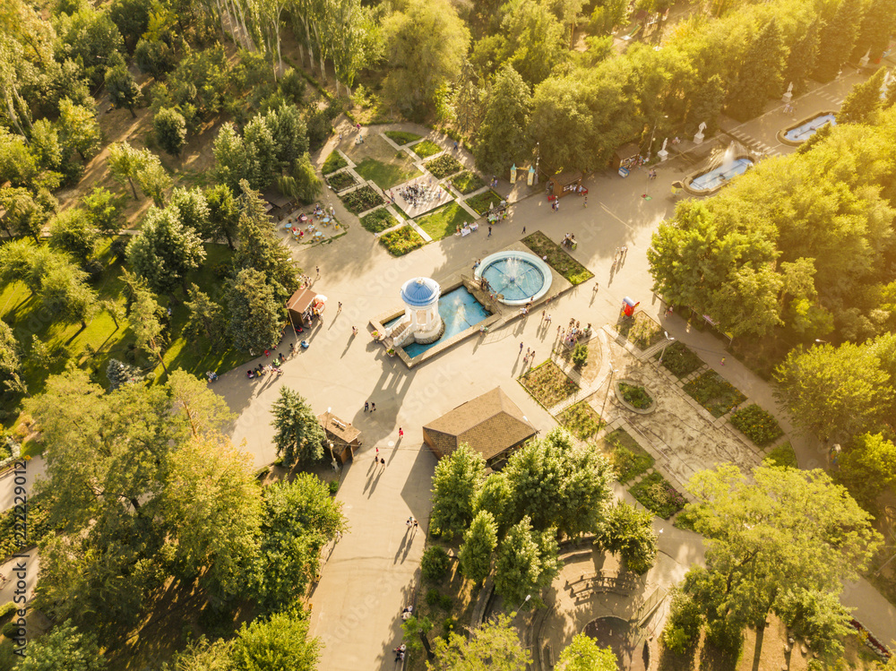 aerial top view of public city summer park with crowd of peoplse walking by the fountains d aerial top view of public city summer park with crowd of peoplse walking by the fountains d