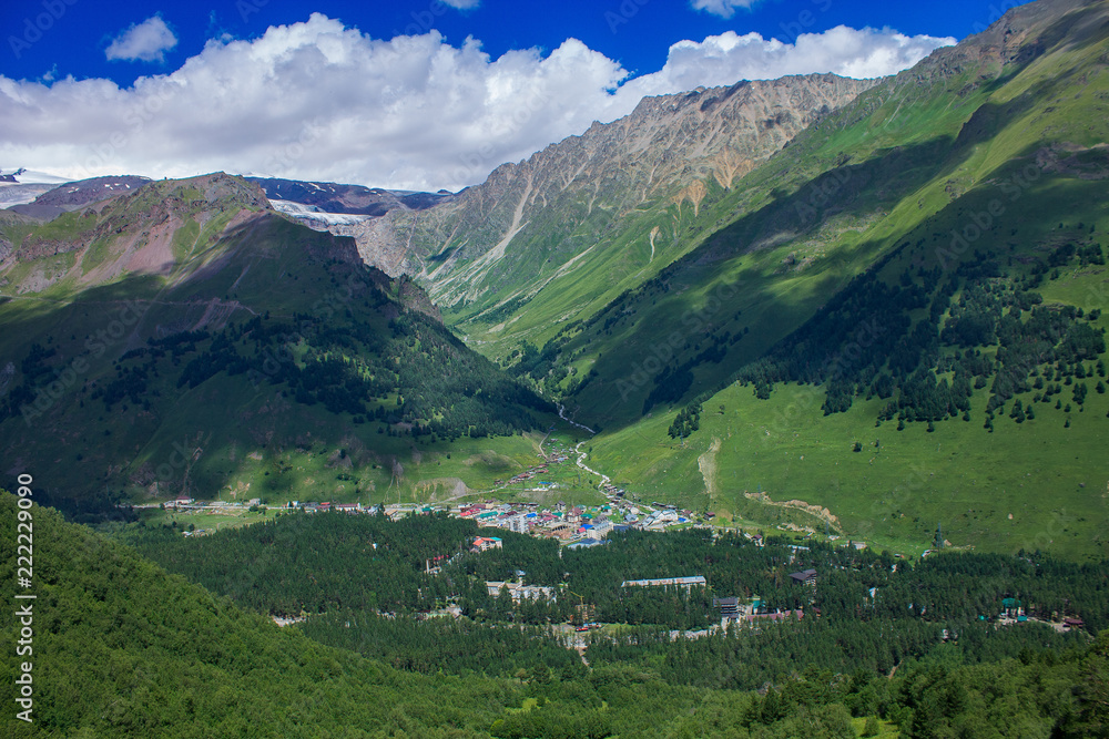 Fototapeta premium Village in the gorge surrounded by the mountains of the North Caucasus.