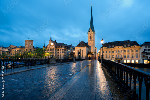 View of historic Zurich city center with famous Fraumunster Church and river Limmat at Lake Zurich , in twilight, Canton of Zurich, Switzerland.