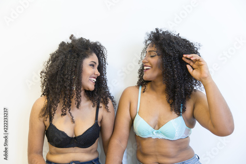 Two young afro girls having fun together, joy, positive, love, friendship, sisters.