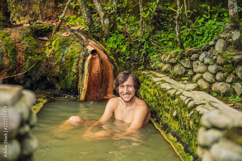 Man tourist in Belulang Hot Springs in Bali, Village Mengesta, Penebel District, Tabanan regency photo