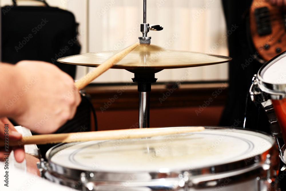 A closeup of a drummer playing a snare drum and high-hat. A closeup of a drummer playing a snare drum and high-hat.