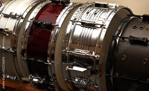 A rack of snare drums in a recording studio.
