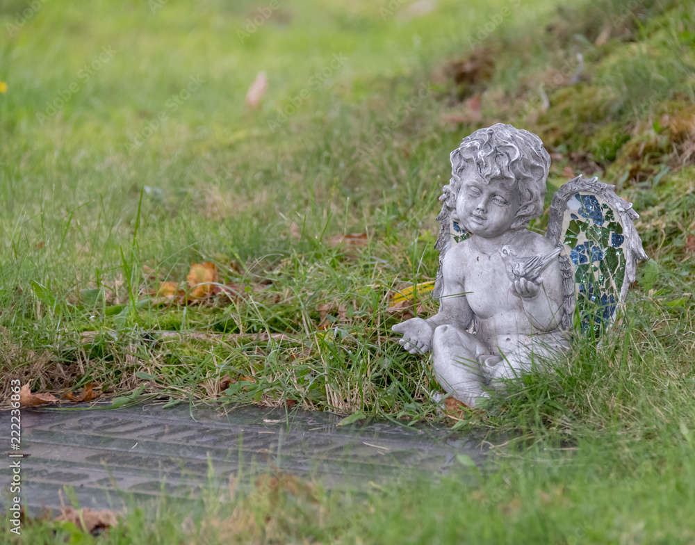 Stone cherub on grave site, Halifax. Stone cherub on grave site, Halifax.