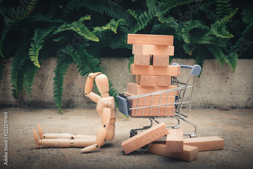 Shopping concept, Wooden model is worry acting after shopping payment