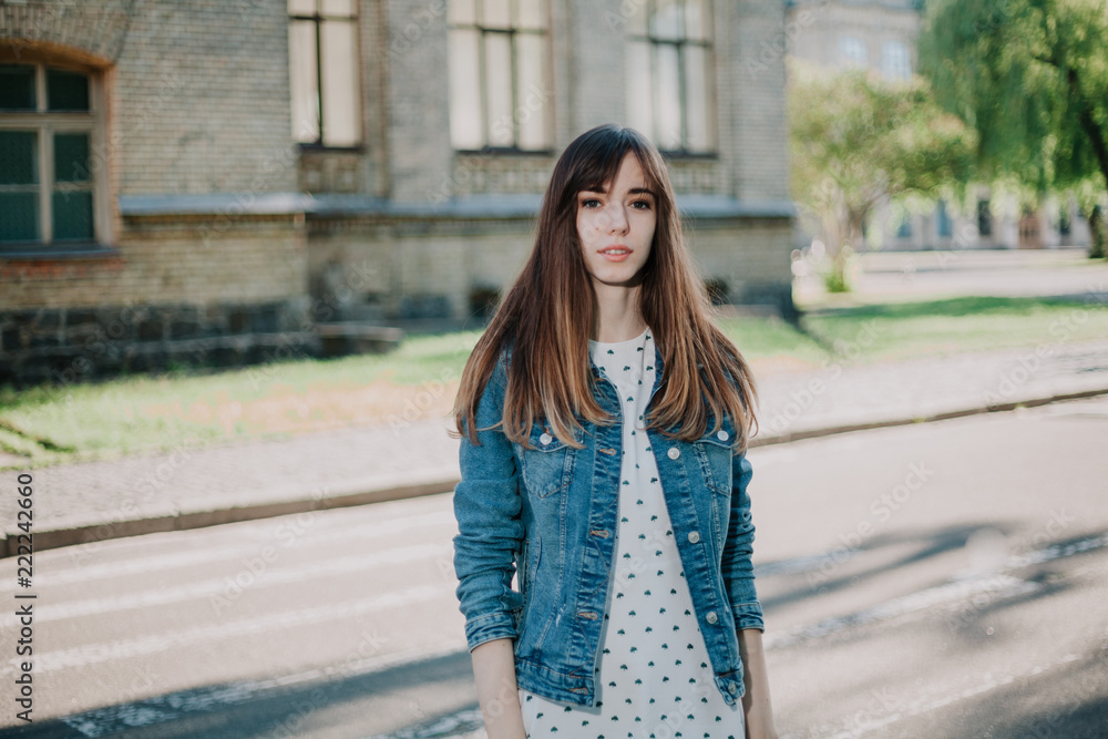 Young cute girl walking in city park Young cute girl walking in city park