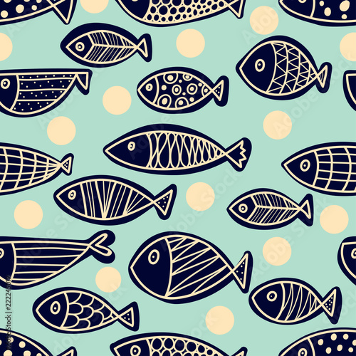 Decorative fish on a mint background with polka dots. Seamless pattern can be used for wallpaper, pattern fills, web page background, surface textures. © vyazovskaya