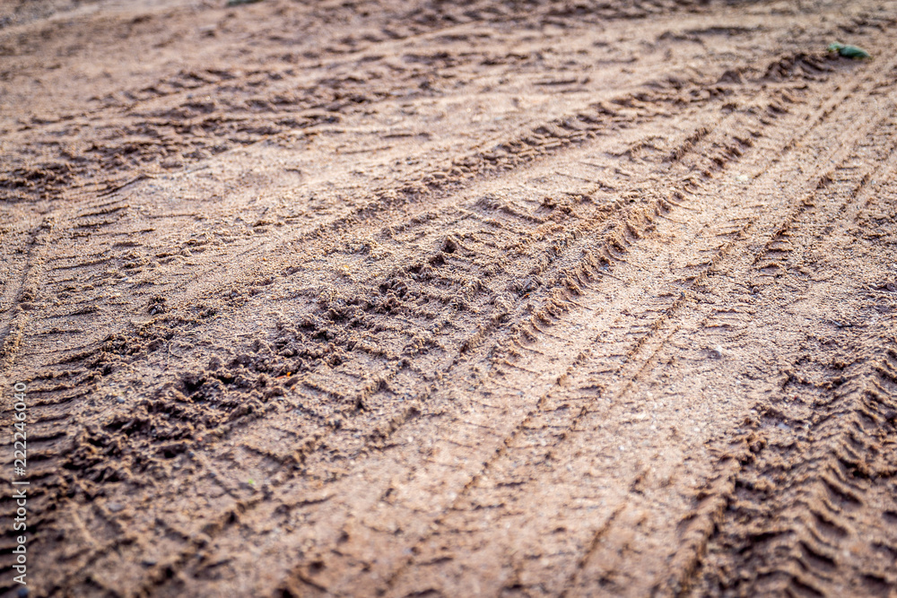 motorcycle tire track print on sand or mud with selective focus motorcycle tire track print on sand or mud with selective focus