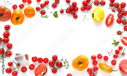 Various tomatoes isolated on white background, top view, flat layout. Concept of healthy eating, food background. Frame of vegetables with space for text.