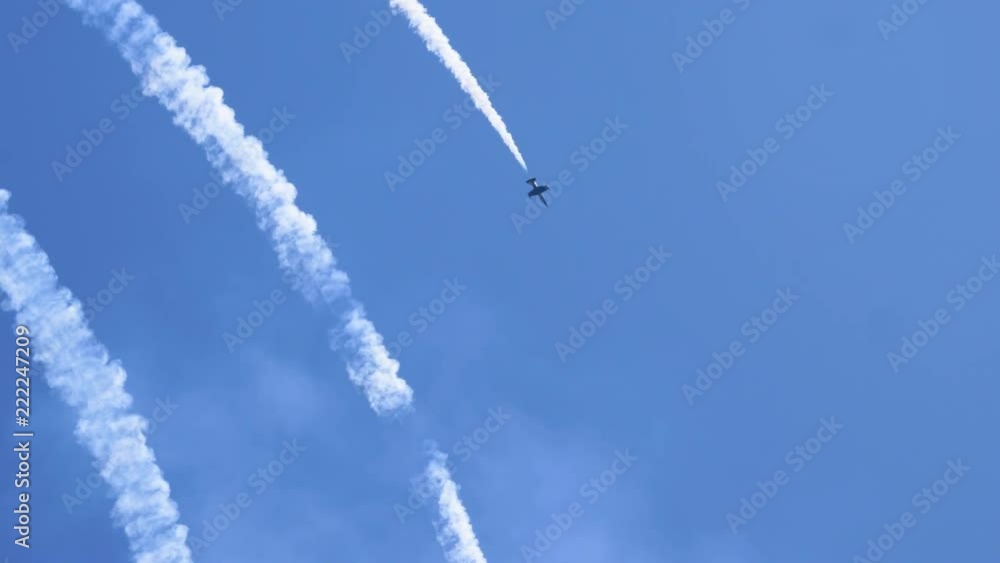 Three airplanes flying on the background of blue sky and leaving a condensation trail. 4K Three airplanes flying on the background of blue sky and leaving a condensation trail. 4K
