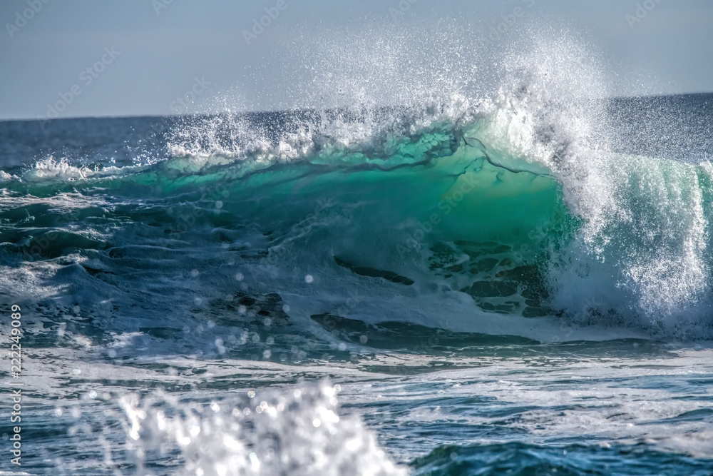 Turquoise blue wave breaking and spray Turquoise blue wave breaking and spray