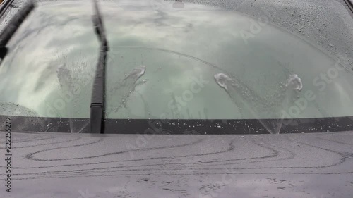 HD video footage showing car windshield wiper and washer in action