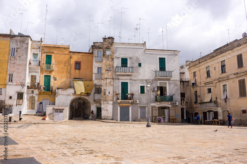 Mediterranean square with ancient buildings with television antennas. Italian traditional architecture. Bari town landmark. Vastness concept. Italian southern town center. Travel and vacation concept. photo