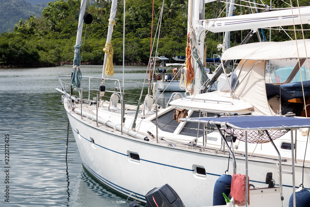Fototapeta premium Monohull Yacht Sailboat docked in Fiji Savusavu bay slip.