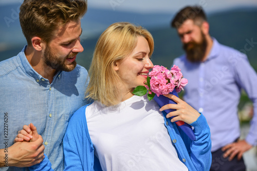 Couple in love happy dating, jealous bearded man watching wife cheating him with lover. Couple romantic date lovers flirting. Lovers meeting outdoor flirt romance relations. Broken heart concept photo