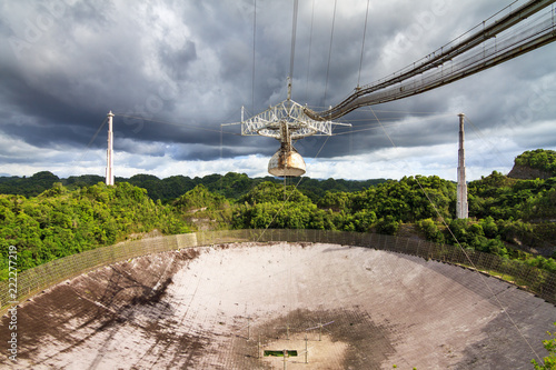The Arecibo Observatory radio telescope in the hills of Arecibo, Puerto Rico photo