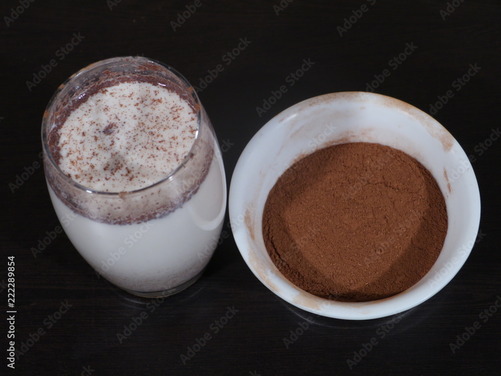 Traditional winter eggnog with milk, rum and cinnamon, sprinkle with grated nutmeg, selective focus,Glass mugs filled with homemade egg nog with cinnamon sticks, Cinnamon Milk, Dalchini Milk Traditional winter eggnog with milk, rum and cinnamon, sprinkle with grated nutmeg, selective focus,Glass mugs filled with homemade egg nog with cinnamon sticks, Cinnamon Milk, Dalchini Milk