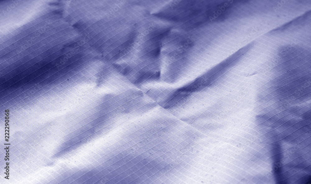 Сrumpled textile surface in blue tone. Сrumpled textile surface in blue tone.