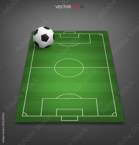 Soccer ball on soccer football field with gray background. Perspective elements. Vector.