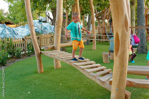 Verona, Italy August 18, 2018: Leoland amusement park. children's playground made of wood. photo