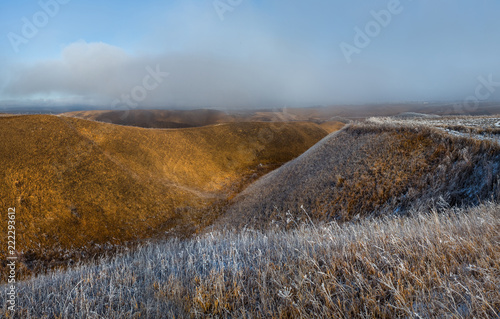 Orange steppe in the snow  hoarfrost. The winter steppe is frostbitten. Steppe landscape  nature.